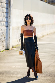 wet hair look, camel jacket, leather short jacket, brown bandeau, strapless top, brown top, black skirt, leather skirt, black gloves, leather gloves, black sunglasses, mani bag, mini bag, mini cabas bag, black stilettos, fashion week, frenchystyle, FW, jonathan paciullo, street style, vertical, full length