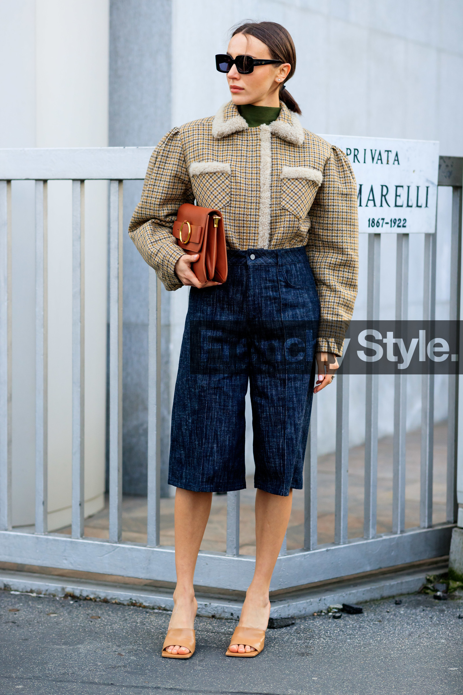 mary leest, checked coat, fur coat, houndstooth printed coat, beige coat, kaki coat, kaki pullover, turtleneck pullover, black sunglasses, square shape glasses, blue bermuda shorts, denim, denim bermuda shorts, camel leather clutch, bottega veneta shoes, beige leather sandals, beige leather slippers, open toe shoes, fashion week, frenchystyle, FW, jonathan paciullo, street style, MFW, MILAN, AUTUMN WINTER 2020-2021, FALL WINTER 2020-2021, FW 20-21, vertical, full length