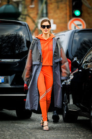 orange hoodie, rain coat, grey jacket, loewe coat, black sunglasses, orange leggings, red handbag, loewe handbag, black sandals, loewe shoes, loewe sandals, gala gonzalez, street style, jonathan paciullo, FW, frenchystyle, fashion week, AUTUMN WINTER 2022-2023, FALL WINTER 2022_2023, FW 22-23, PFW, PARIS, full length, vertical