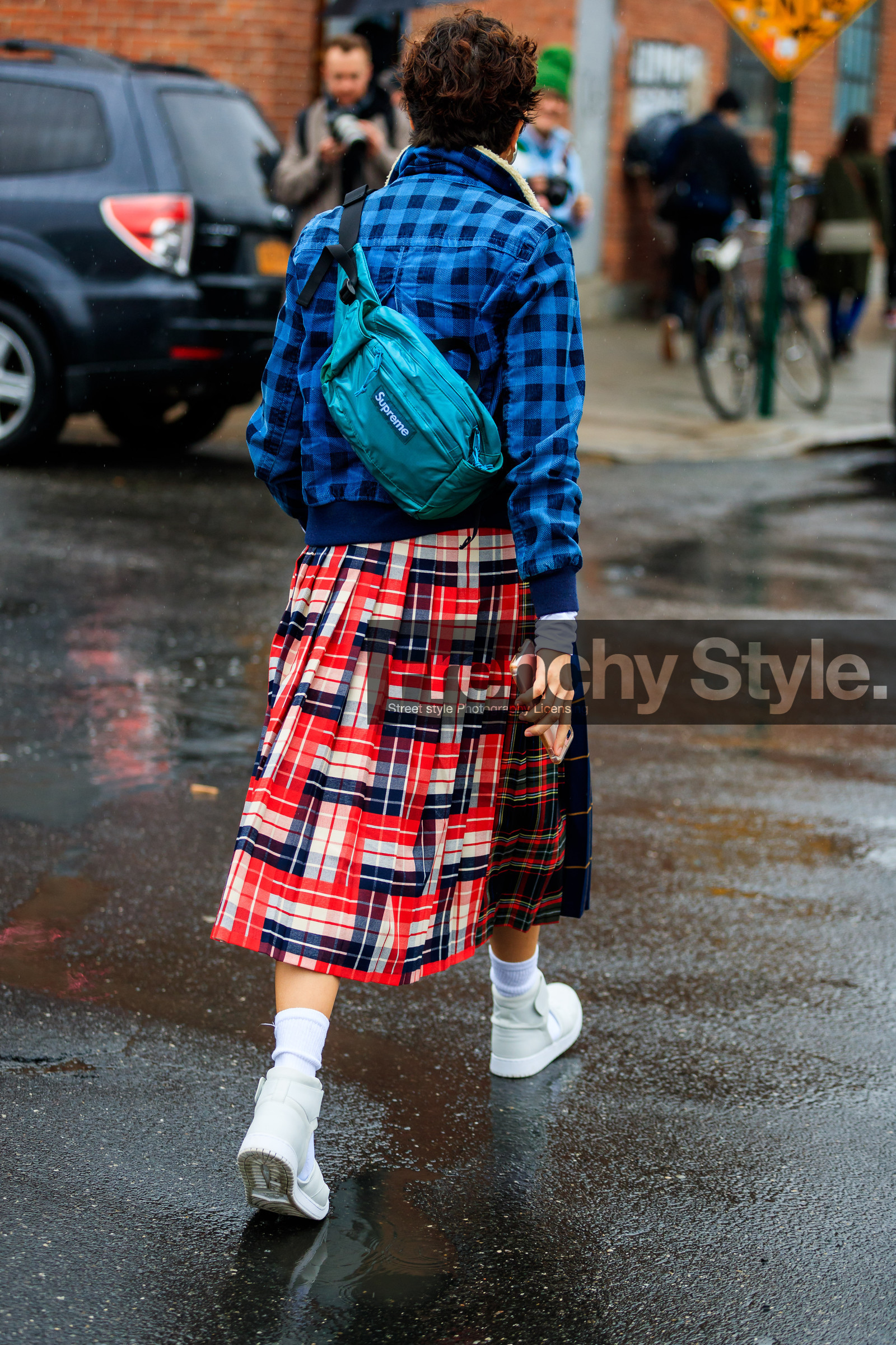 blue bag, blue jacket, blue skirt, checked, checked jacket, fanny pack, fur collar, graphic jacket, graphic skirt, leather bag, leather shoes, plaid, pleated skirt, printed jacket, printed skirt, red skirt, supreme, tartan, white sneakers, white socks, street style, jonathan paciullo, FW, frenchystyle, fashion week, NYFW, NEW YORK, AUTUMN WINTER 2018-2019, AW 18-19, FALL WINTER 2018-2019, FW 18-19, vertical, full length