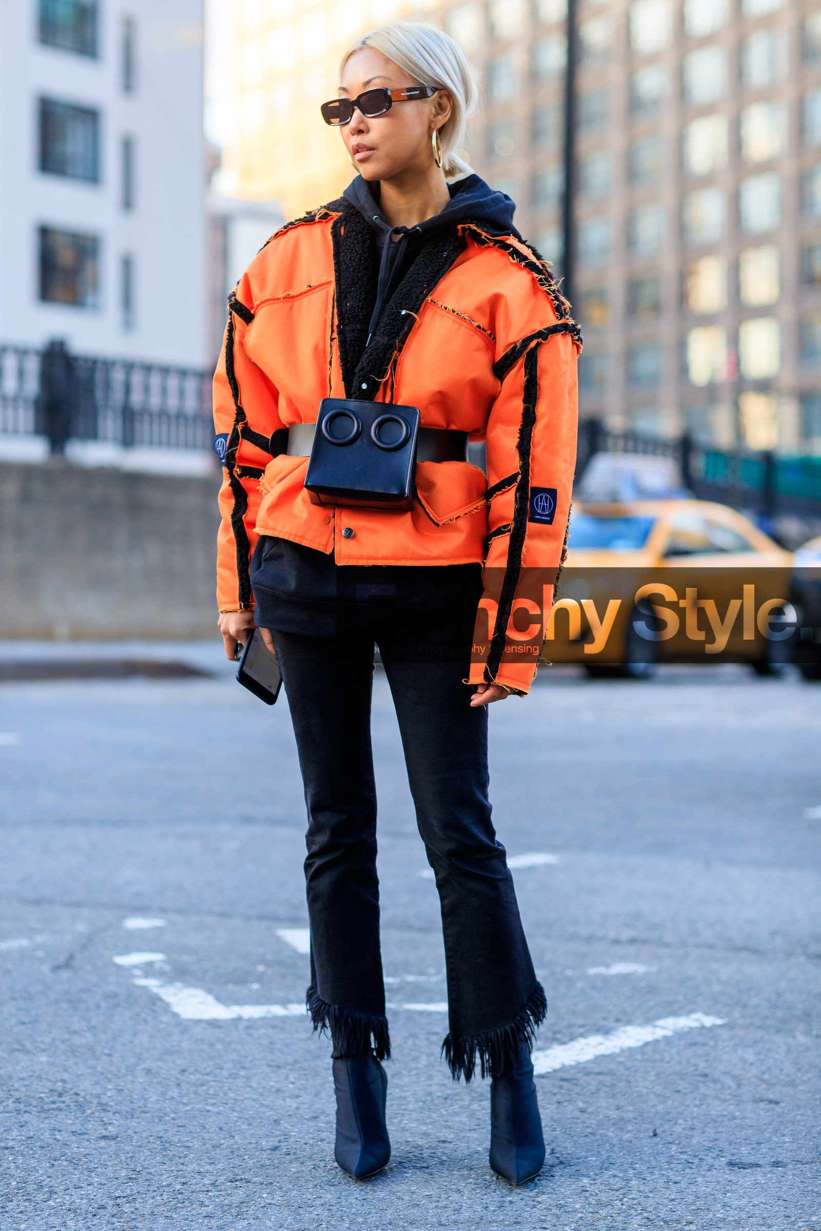 black bag, black belt, black denim, black shoes, black sweater, denim pants, fanny pack, graphic jacket, high heels, hoodie, jeans, leather bag, leather belt, leather shoes, orange jacket, printed jacket, sunglasses, trousers, street style, jonathan paciullo, FW, frenchystyle, fashion week, NYFW, NEW YORK, AUTUMN WINTER 2018-2019, AW 18-19, FALL WINTER 2018-2019, FW 18-19, vertical, full length, vanessa hong