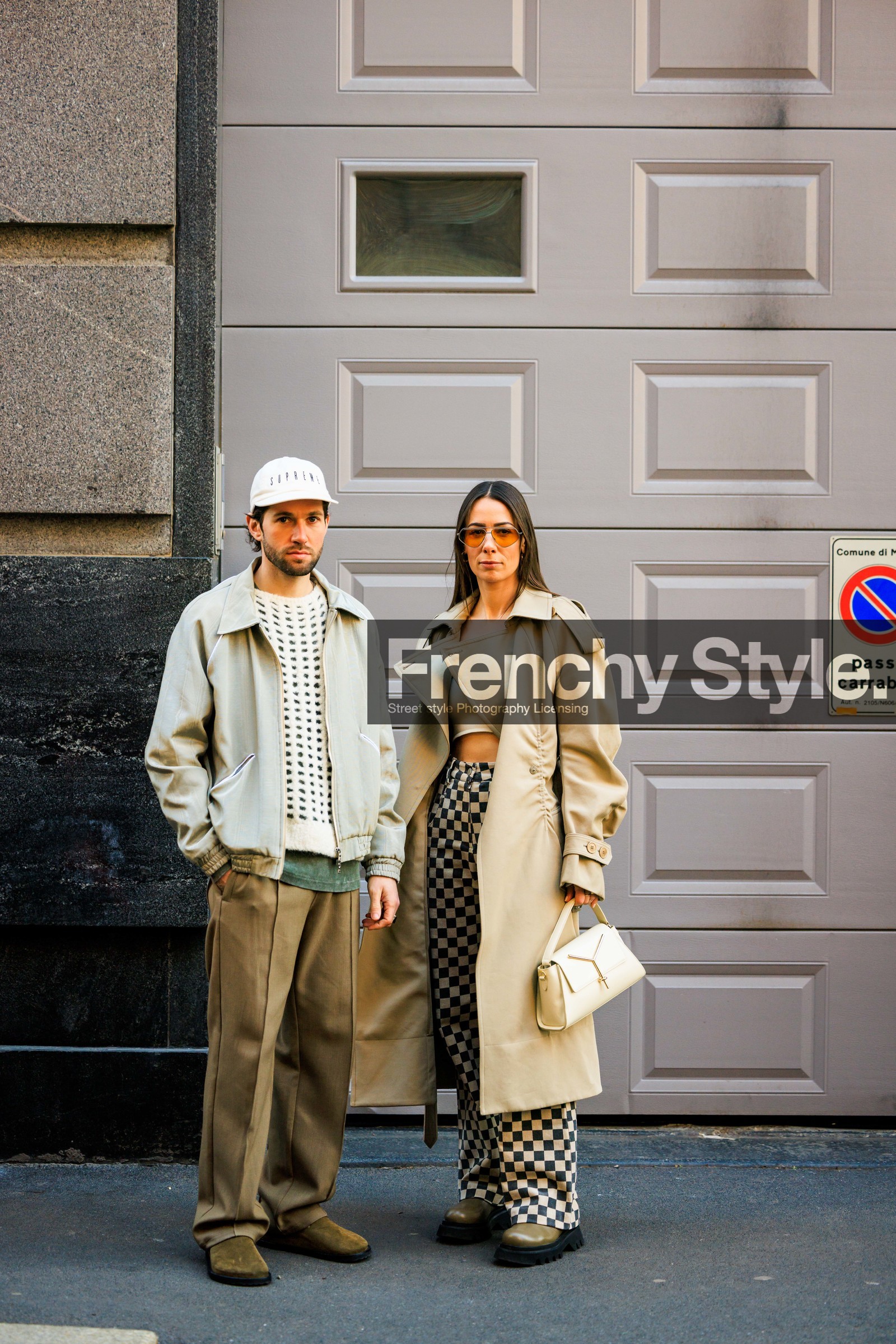 beige trench, classic trench coat, checked pants, cropped top, cut out top, white top, beige boots, white cap, couple, pilot sunglasses, brown pants, suede boots, kaki boots, knitted jumper, white jumper, grey jacket, bomber jacket, relaxed look, JS roques, alice & j.s, alice barbier, street style, jonathan paciullo, FW, frenchystyle, fashion week, MFW, MILAN, FALL WINTER 2022_2023, AUTUMN WINTER 2022-2023, FW 22-23, vertical, full length