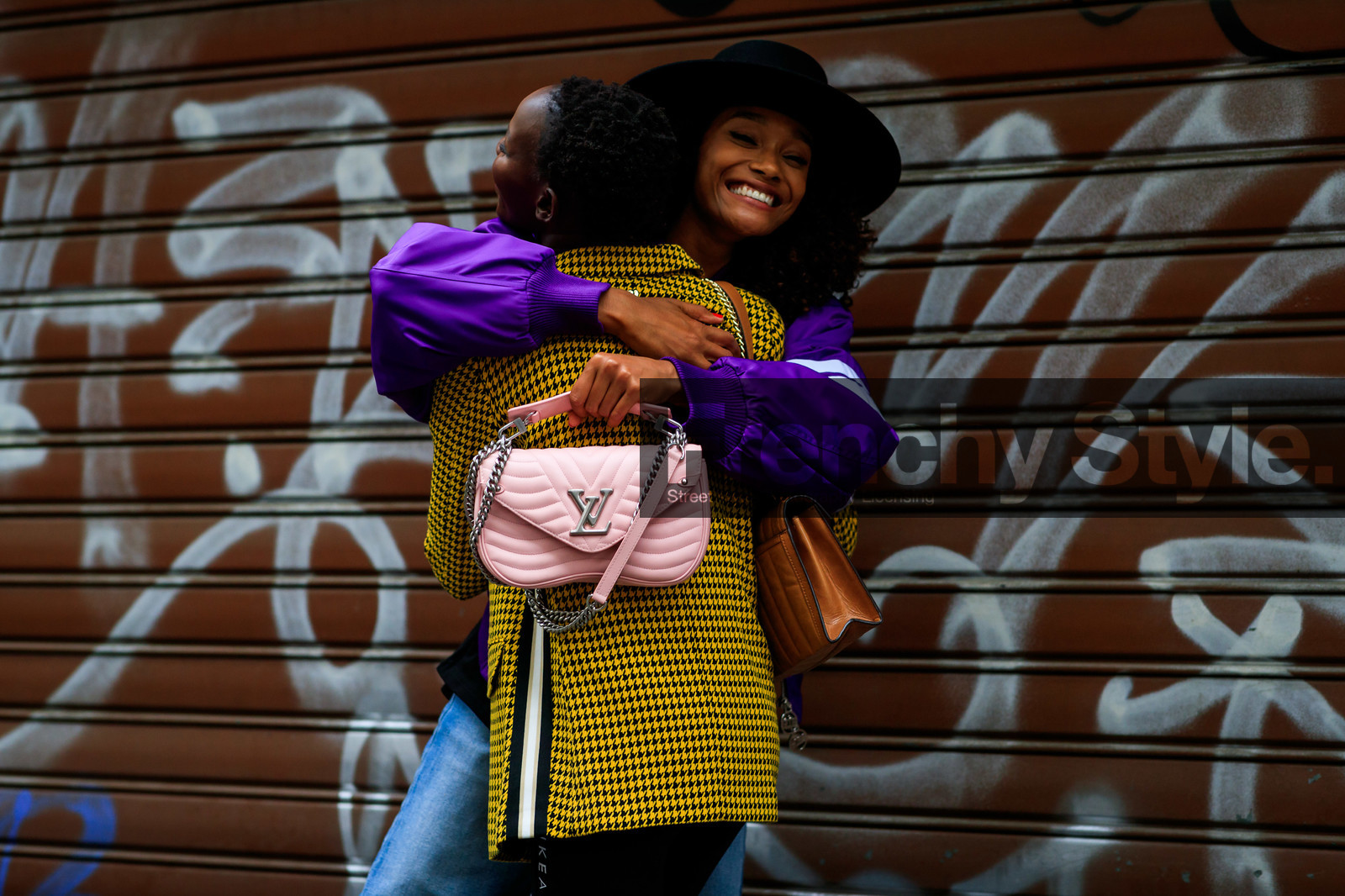 model, Shanelle Nyasiase, black eyeliner, black t-shirt, black shorts, checked jacket, dangling earrings, yellow jacket, louis vuitton bag, pink leather bag, quilted bag, silvered starp bag, purple coat, black hat, close up detail, back details, fashion week, frenchystyle, FW, jonathan paciullo, street style, atmosphere details, detail, horizontal, MFW, MILAN, SPRING SUMMER 2020, SS 20
