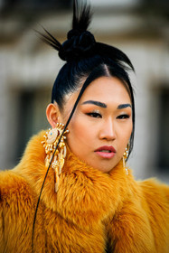 furry coat, yellow coat, golden earrings, schiaparelli, surrealism, close up, details, hair, make up, hair bow, fashion week, frenchystyle, FW, jonathan paciullo, street style, PARIS, PFW, SPRING SUMMER 2022, SS 22, atmosphere details, detail, vertical, jaime xie