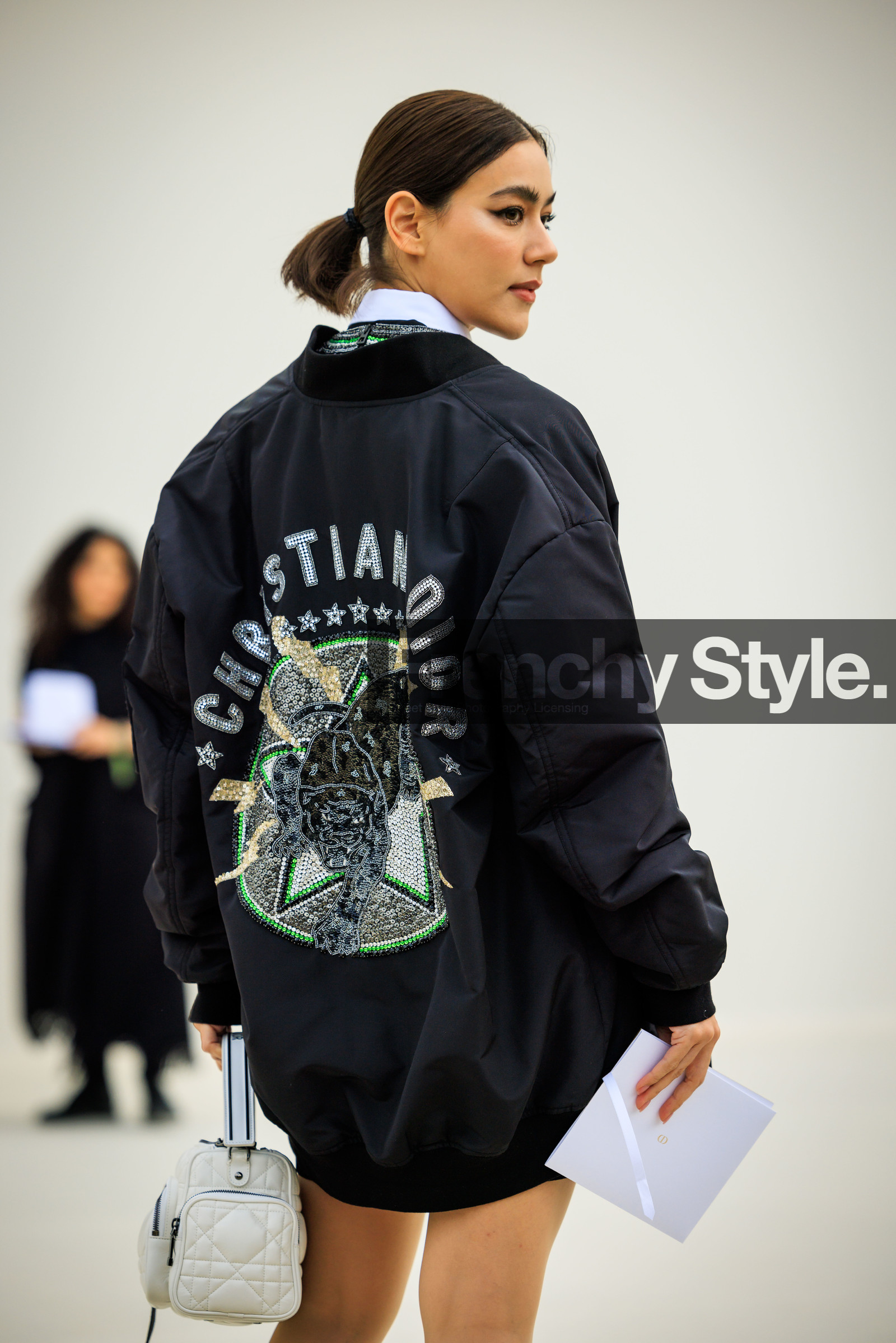 dior jacket, bomber jacket, black jacket, back details, dior bag, white bag, pony tail, Kimberley Anne Voltemas, fashion week, frenchystyle, FW, jonathan paciullo, street style, AUTUMN WINTER 2022-2023, FALL WINTER 2022_2023, FW 22-23, PFW, PARIS, vertical, detail