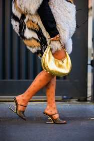 golden handbag, golden ring, details, fendi stockings, camel stocking, fendi sandals, fendi slingbacks, black sandals, fendi logo stockings, fendi handbag, furry coat, nina suess, fashion week, frenchystyle, FW, jonathan paciullo, street style, MFW, MILAN, FALL WINTER 2022_2023, AUTUMN WINTER 2022-2023, FW 22-23, vertical, atmosphere details