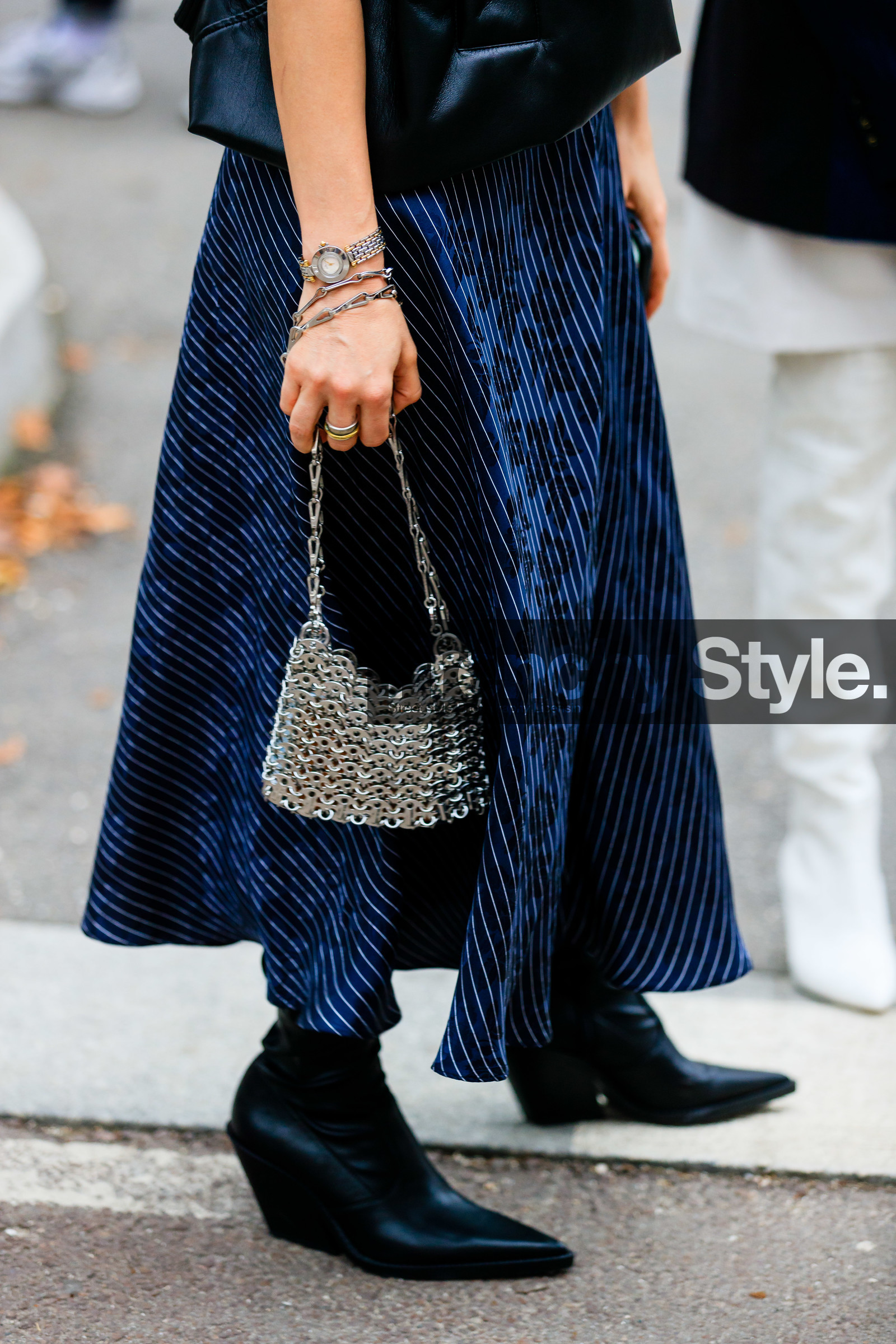navy blue dress, striped dress, long dress, silvered bag, metal bag, metalic bag, paco rabanne bag, paco rabanne boots, silvered watch, floral printed dress, cowboy boots, black leather boots, julia comil, street style, jonathan paciullo, FW, frenchystyle, fashion week, MFW, MILAN, SPRING SUMMER 2021, SS 21, vertical, detail