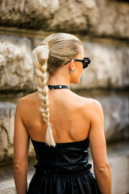 details, black sunglasses, loewe sunglasses, black dress, leather dress, braid tail, pony tail hair, silver earrings, caro daur, street style, jonathan paciullo, FW, frenchystyle, fashion week, AUTUMN WINTER 2022-2023, FALL WINTER 2022_2023, FW 22-23, PFW, PARIS, vertical, detail