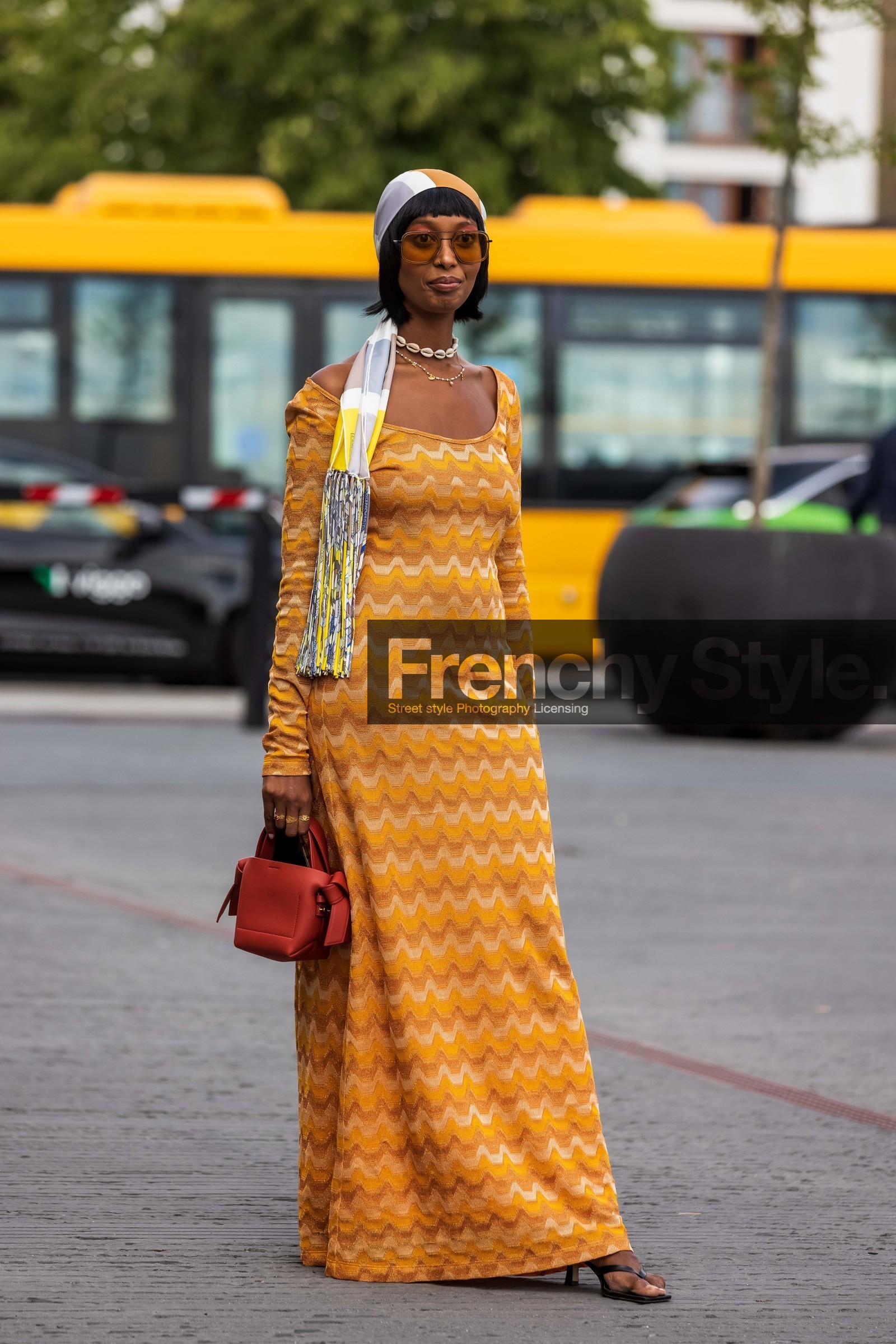 Mona M Ali, orange dress, yellow dress, long dress, geometrical printed dress, knit dress, knitwear, long sleeves dress, shell chocker, shell necklace, pearl necklace, charms necklace, multi necklace, aviator sunglasses, smoked sunglasses, sheer sunglasses, hair scarf, silk scarf, white scarf, yellow scarf, fringe scarf, hermes scarf, camel leather bag, red leather bag, hand bag, mini bag, acne studios bag, fashion week, frenchystyle, FW, jonathan paciullo, street style, SPRING SUMMER 2022, SS 22, COPENHAGEN, CPHFW, vertical, full length