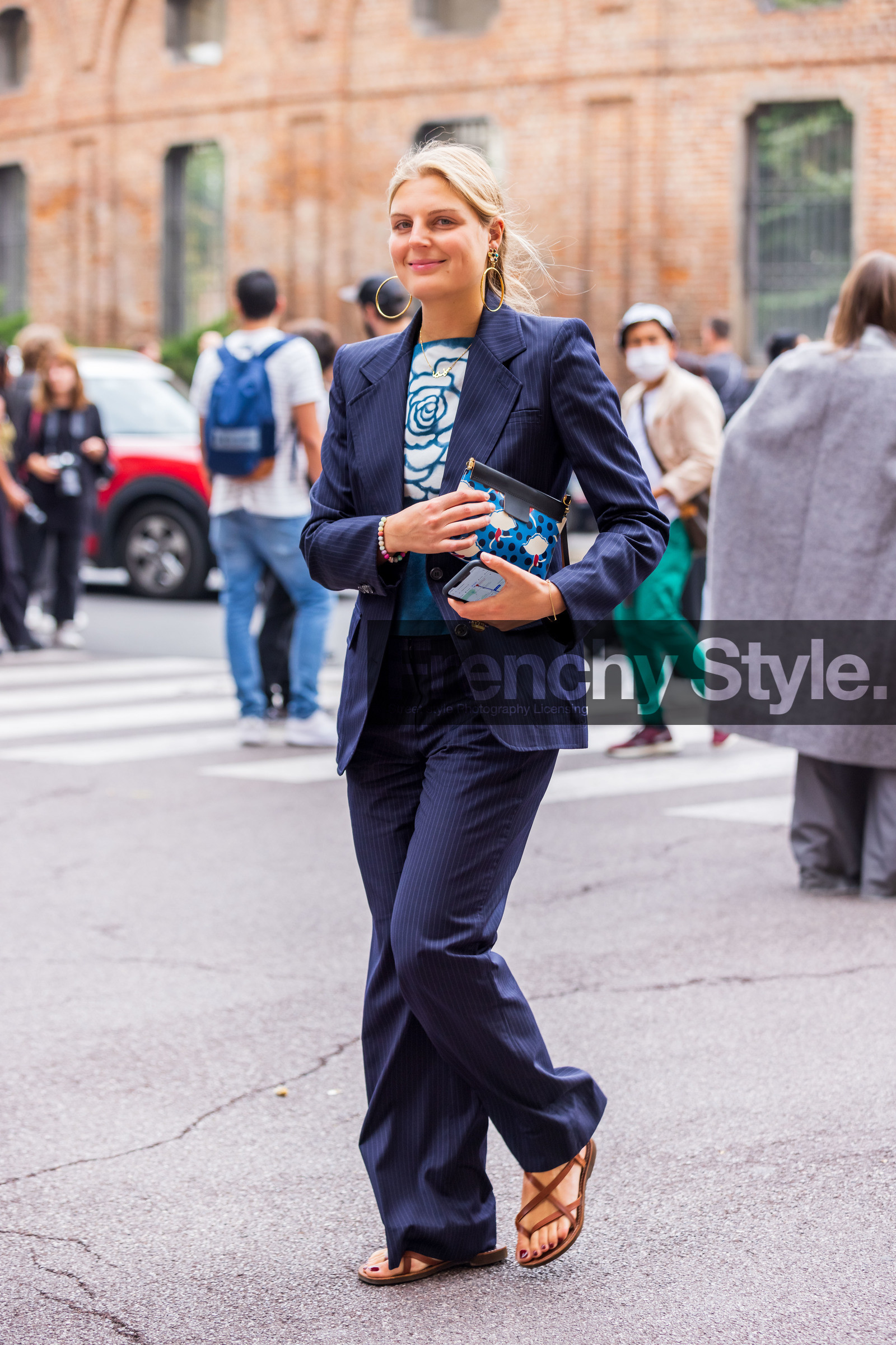 blazer, blue blazer, blue knit, blue pants, blue pouch, brown sandals, Claire Beermann, dots, earrings, fines lines, flower, flower print, gold earrings, hoops, knit, large pants, leather sandals, oversize earrings, pants, pouch, print, printed pouch, sandals, striped blazer, striped pants, stripes, suit, white lines, fashion week, frenchystyle, FW, jonathan paciullo, street style, SPRING SUMMER 2022, SS 22, MFW, MILAN, vertical, full length