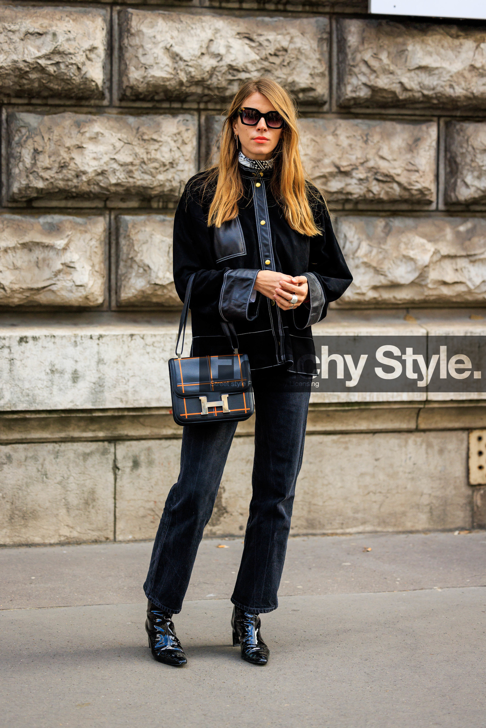 black boots, pattent boots, black sunglasses, black jacket, buttoned jacket, hermes bag, logo bag, leather bafg, hermes, dark jeans, pearl ring, white scarf, printed scarf, ginger hair, monica ainley, street style, jonathan paciullo, FW, frenchystyle, fashion week, AUTUMN WINTER 2022-2023, FALL WINTER 2022_2023, FW 22-23, PARIS, PFW, full length, vertical