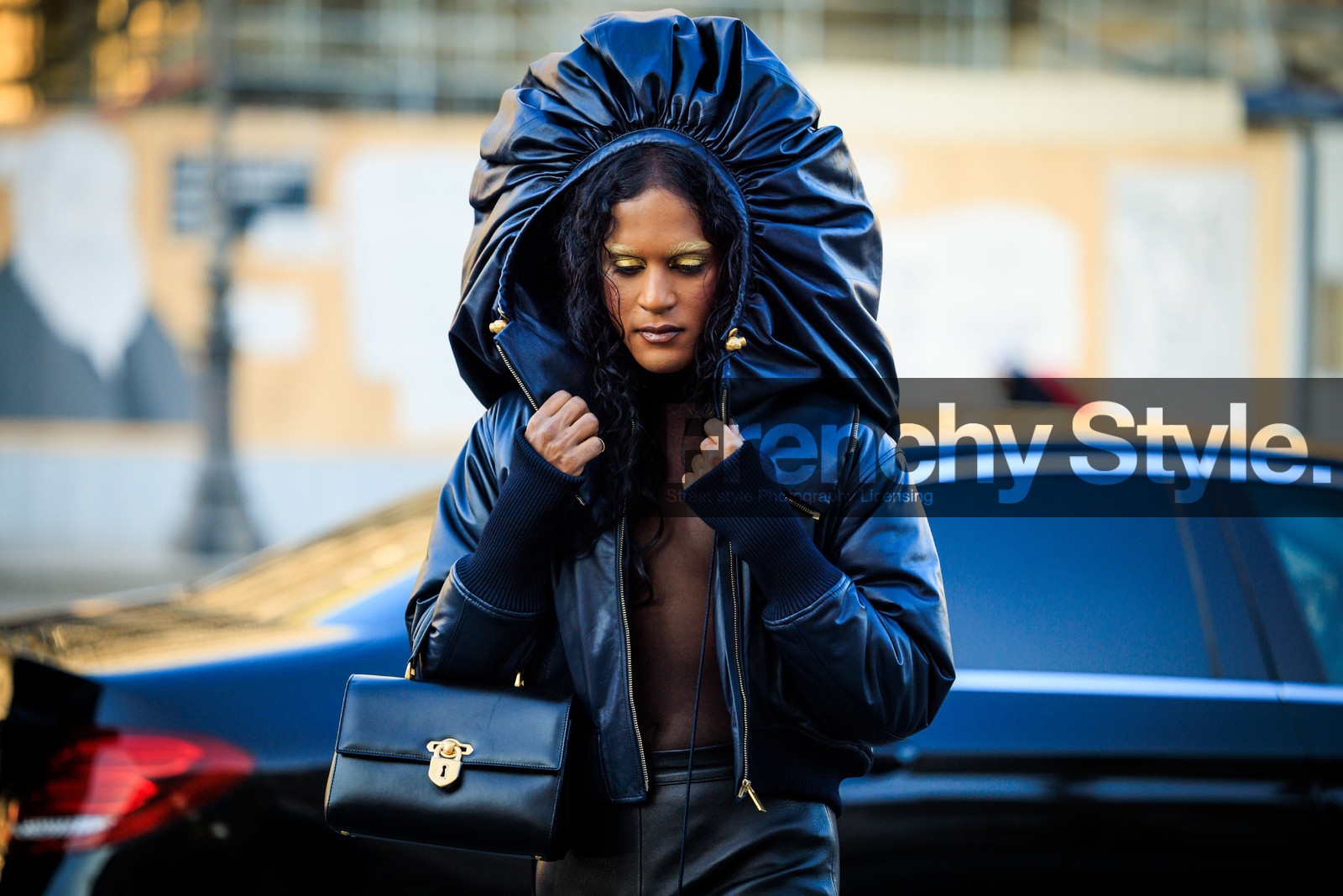 schiaparelli, black hood, bomber jacket, short jacket, leather jacket, black jakcet, transparent top, black top, leather pants, black handbag, leather bag, lock bag, schiaparelli jacket, golden eyes, curls, fashion week, frenchystyle, FW, jonathan paciullo, street style, PARIS, PFW, SPRING SUMMER 2022, SS 22, atmosphere details, detail, horizontal