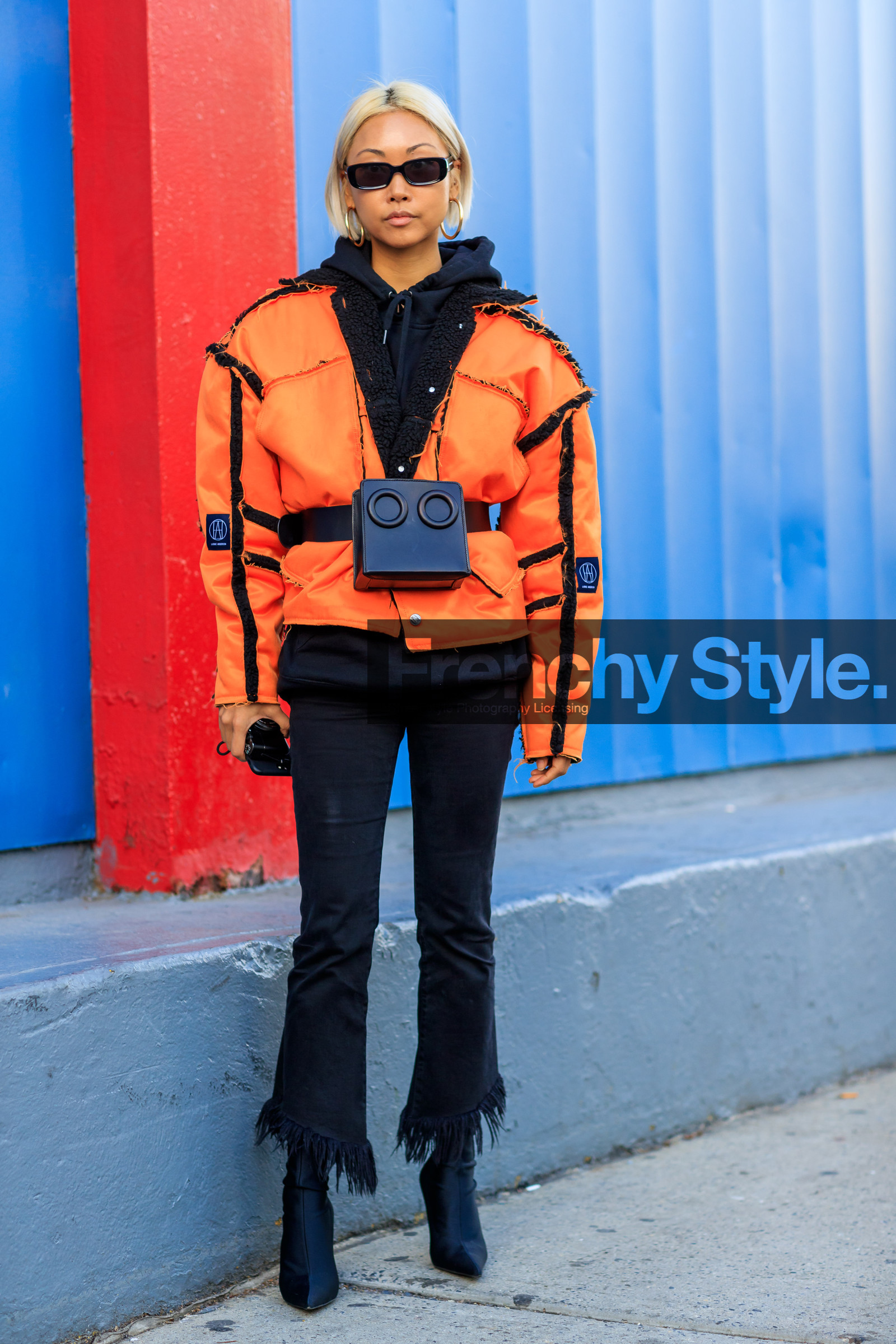black bag, black belt, black denim, black shoes, black sweater, denim pants, fanny pack, graphic jacket, high heels, hoodie, jeans, leather bag, leather belt, leather shoes, orange jacket, printed jacket, sunglasses, trousers, street style, jonathan paciullo, FW, frenchystyle, fashion week, NYFW, NEW YORK, AUTUMN WINTER 2018-2019, AW 18-19, FALL WINTER 2018-2019, FW 18-19, vertical, full length, vanessa hong