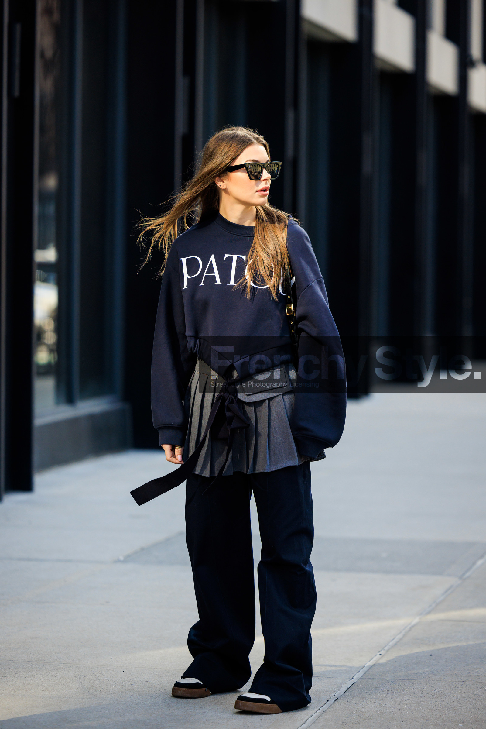 patou black sweatshirt, black cat eye sunglasses, silver pleated skirt, school girl skirt, oversiwed black pants, black and white sneakers, Allegra shaw, fashion week, frenchystyle, FW, jonathan paciullo, street style, NYFW, NEW YORK, AUTUMN WINTER 2022-2023, FALL WINTER 2022_2023, FW 22-23, vertical, full length