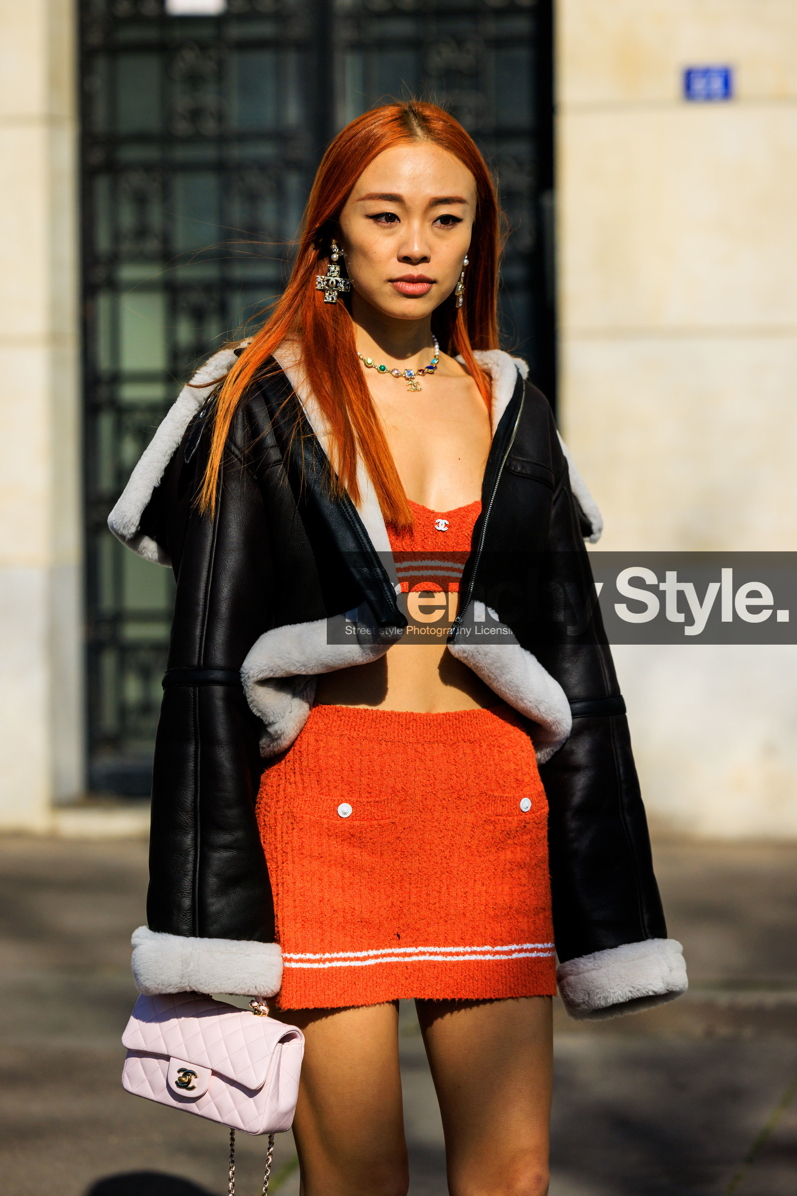 chanel, orange hair, chanel earrings, cross earrings, chanel necklace, leather jacket, black jacket, chanel set, orange top, orange skirt, knitwear, knitted top, knitted skirt, pink bag, chanel bag, light pink bag chanel handbang, FW 22-23, FALL WINTER 2022_2023, AUTUMN WINTER 2022-2023, fashion week, frenchystyle, FW, jonathan paciullo, street style, PFW, PARIS, vertical, detail