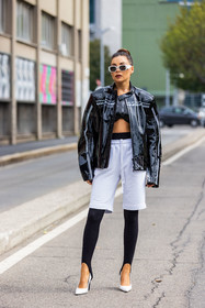 bermuda, black crop top, black jacket, black legging, crop top, jacket, jogging short, Karina Nigay, leather shoes, legging, sport look, sunglasses, vinyl jacket, white bermuda, white heels, white shoes, white sunglasses, fashion week, frenchystyle, FW, jonathan paciullo, street style, SPRING SUMMER 2022, SS 22, MFW, MILAN, vertical, full length