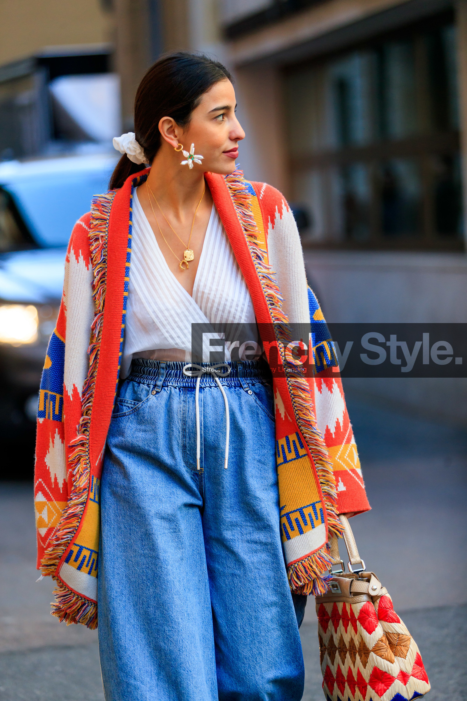 bettina looney, blue denim, denim pants, earrings, fendi, geometric, graphic bag, graphic jacket, jeans, leather bag, multicolor bag, multicolor jacket, poncho, printed bag, printed jacket, trousers, white top, MILAN, MFW, fashion week, frenchystyle, FW, jonathan paciullo, street style, AUTUMN WINTER 2019-2020, AW 19-20, FALL WINTER 2019-2020, FW 19-20, vertical, atmosphere details, detail