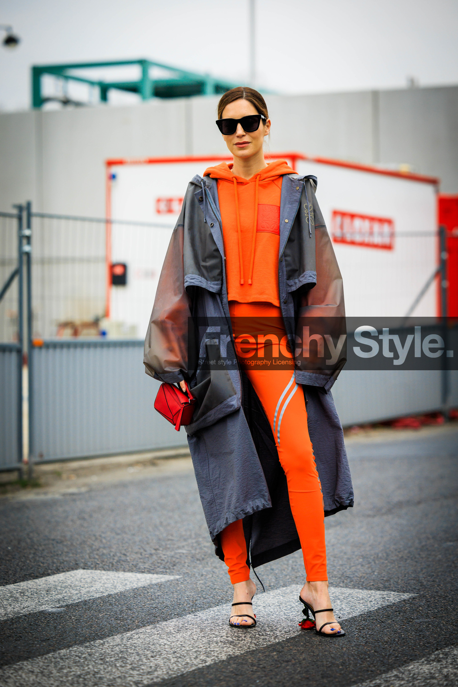 orange hoodie, rain coat, grey jacket, loewe coat, black sunglasses, orange leggings, red handbag, loewe handbag, black sandals, loewe shoes, loewe sandals, gala gonzalez, street style, jonathan paciullo, FW, frenchystyle, fashion week, AUTUMN WINTER 2022-2023, FALL WINTER 2022_2023, FW 22-23, PFW, PARIS, full length, vertical