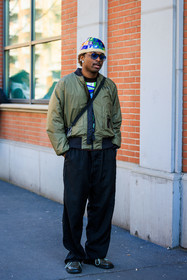 multicolor beanie, knitted beanie, green jacket, nylon bomber jacket, black pants, crossbody bag, black crossbody, pearl earrings, black shoes, baggy pants, blue filter sunglasses, fashion week, frenchystyle, FW, jonathan paciullo, street style, MFW, MILAN, FALL WINTER 2022_2023, AUTUMN WINTER 2022-2023, FW 22-23, vertical, full length