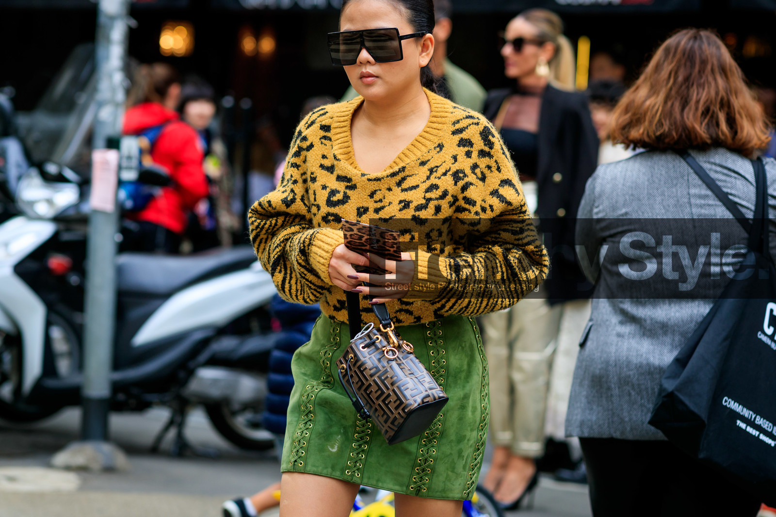 square shape glasses, black sunglasses, saint laurent sunglasses, leopard printed pullover, yellow pullover, jacquard pullover, green skirt, suede skirt, mini skirt, laced skirt, studs skirt, fendi bag, mini bag, monogrammed bag, bucket bag, hand bag, brown leather bag, fashion week, frenchystyle, FW, jonathan paciullo, street style, horizontal, atmosphere details, detail, MFW, MILAN, SPRING SUMMER 2020, SS 20