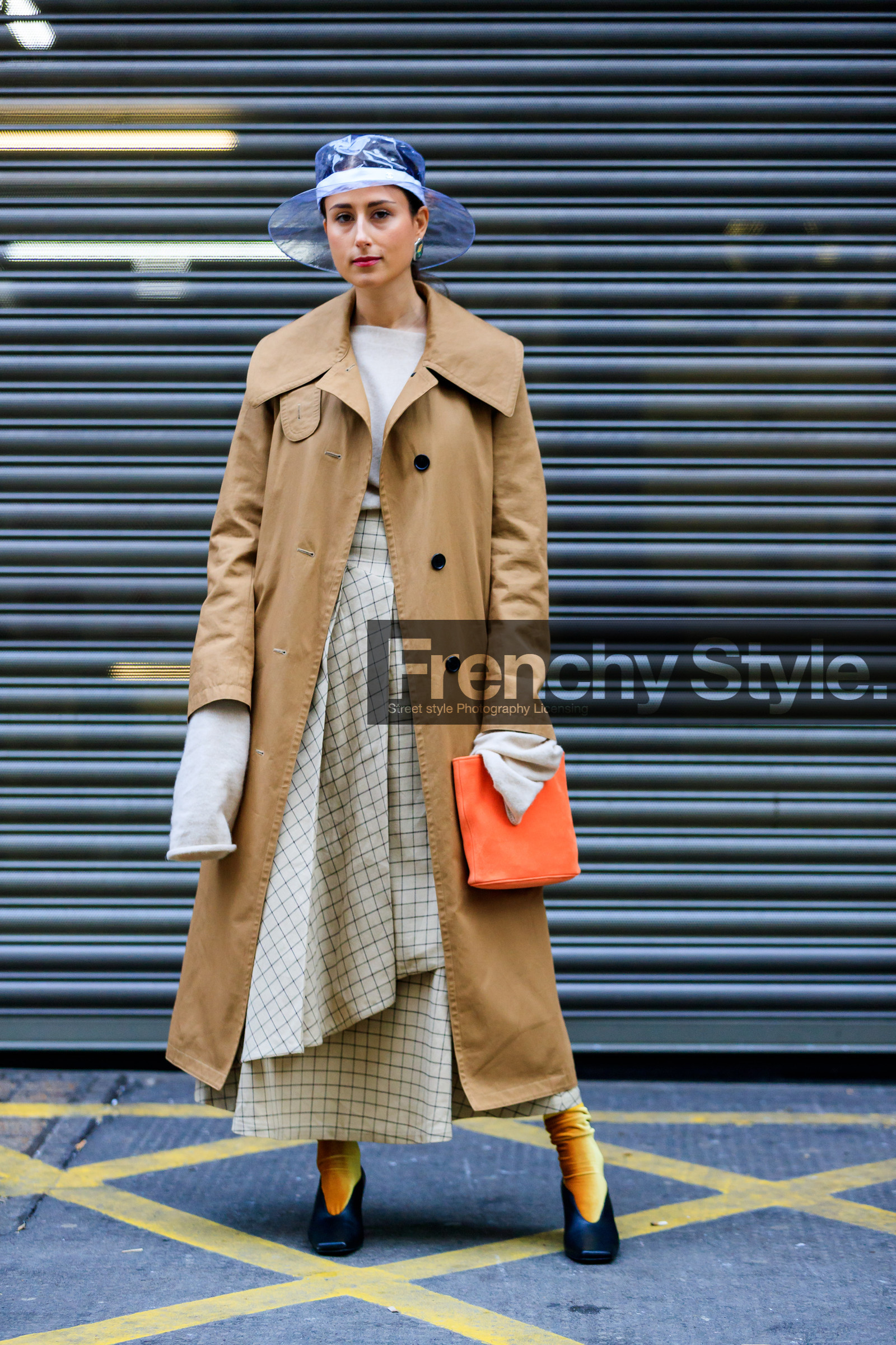 beige coat, beige skirt, beige sweater, black shoes, chanel, graphic skirt, high heels, leather bag, leather shoes, orange bag, printed skirt, transparent hat, trench coat, yellow socks, street style, jonathan paciullo, FW, frenchystyle, fashion week, LFW, LONDON, AUTUMN WINTER 2018-2019, AW 18-19, FALL WINTER 2018-2019, FW 18-19, vertical, full length, julia haghjoo