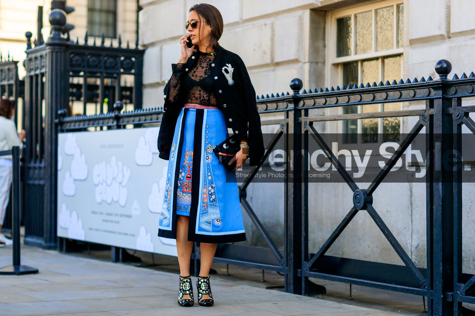 black bag, black jacket, black top, blue skirt, graphic bag, graphic jacket, graphic skirt, high heels, lace top, leather bag, leather shoes, over the shoulder, printed bag, printed jacket, printed skirt, see through, shiny shoes, sunglasses, teddy jacket, fashion week, frenchystyle, FW, jonathan paciullo, street style, LFW, LONDON, SPRING SUMMER 2019, SS 19, atmosphere details, horizontal, full length