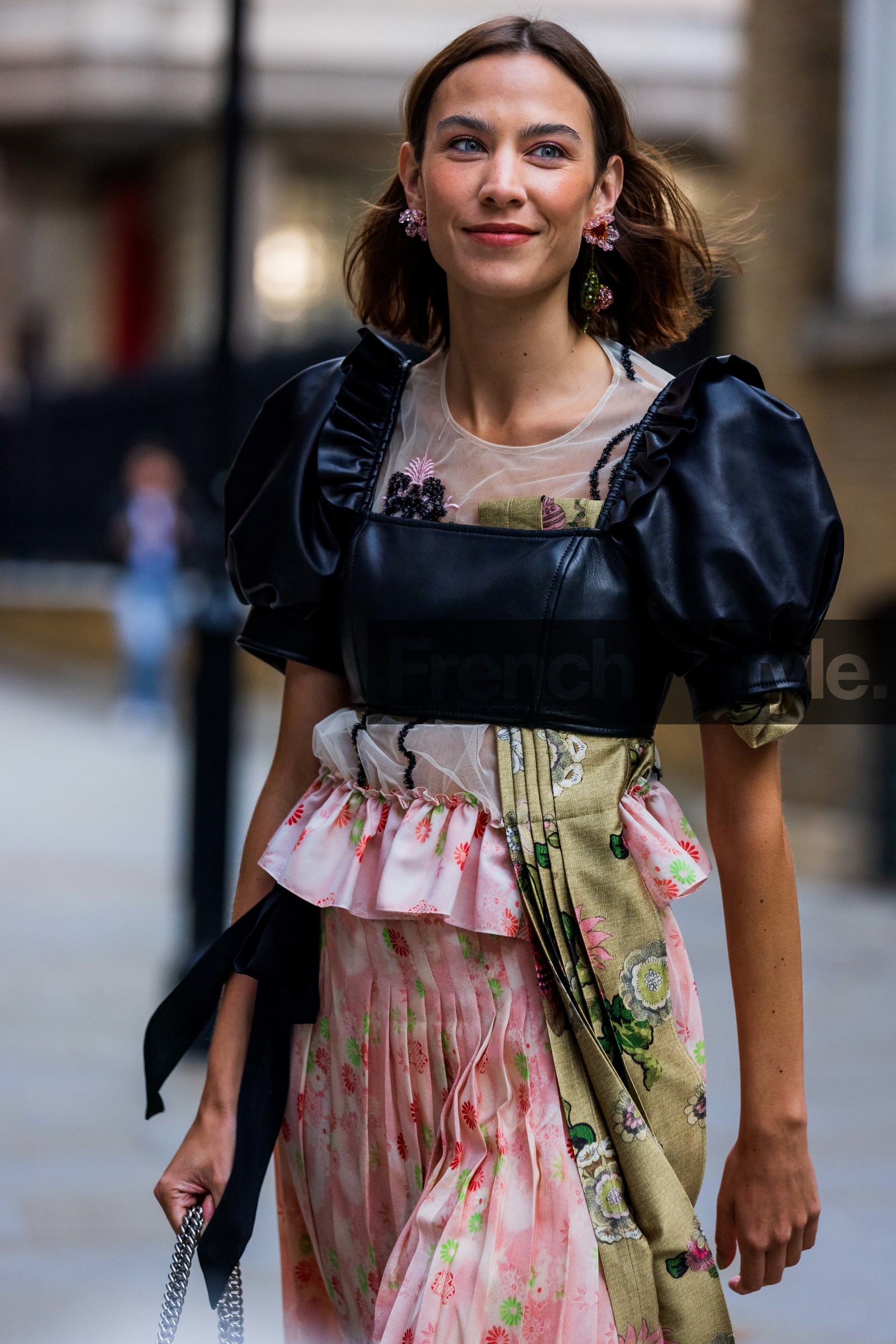 Alexa Chung, pleated skirt, pleated dress, black, leather, flower dress, flower print, flowered dress, flowers, midi dress, dress, earrings, simone rocha, fashion week, frenchystyle, FW, jonathan paciullo, street style, SS 22, SPRING SUMMER 2022, LFW, LONDON, vertical, atmosphere details, detail
