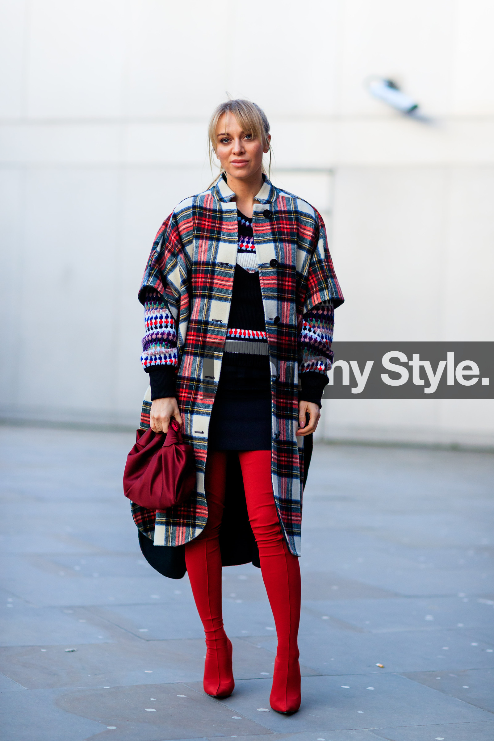 black skirt, black top, checked, graphic jacket, graphic sweater, high boots, high heels, leather bag, leather shoes, mini skirt, plaid, printed jacket, printed sweater, red bag, red boots, tartan, street style, jonathan paciullo, FW, frenchystyle, fashion week, LFW, LONDON, AUTUMN WINTER 2018-2019, AW 18-19, FALL WINTER 2018-2019, FW 18-19, vertical, full length, sandra hagelstam