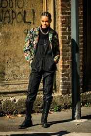 black jumpsuit, black boots, combat boots, laced boots, braid, flowered jacket, multicolor jacket, golden chain, black top, braids, model, fashion week, frenchystyle, FW, jonathan paciullo, street style, vertical, full length