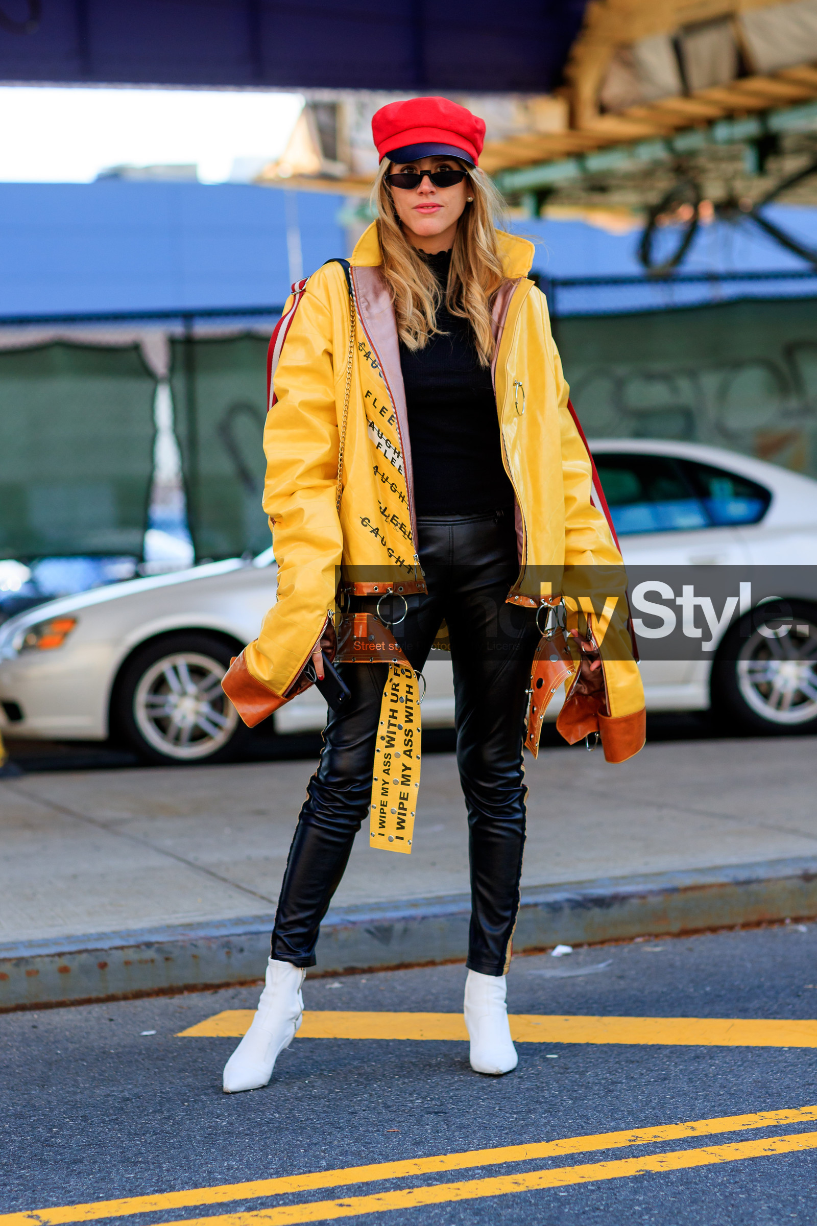 black pants, black sweater, graphic jacket, high heels, leather jacket, leather pants, leather shoes, message, printed jacket, red hat, sunglasses, trousers, white shoes, yellow jacket, street style, jonathan paciullo, FW, frenchystyle, fashion week, NYFW, NEW YORK, AUTUMN WINTER 2018-2019, AW 18-19, FALL WINTER 2018-2019, FW 18-19, vertical, full length