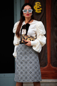 white sunglasses, white skirt, white shirt, white blouse, ruffle blouse, ruffle sleeves, ruffle shirt, monogrammed skirt, black skirt, animal skin clutch, mirror sunglasses, louis vuitton clutch, louis vuitton skirt, louis vuitton sunglasses, golden clutch, PARIS, PFW, fashion week, frenchystyle, FW, jonathan paciullo, street style, SPRING SUMMER 2021, SS 21, vertical, atmosphere details, detail