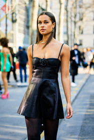 valentino, valetino earrings, logo earrings, mini dress, black dress, leather dress, black stockings, rose dress, valentino dress, close up, sarah lysander, street style, jonathan paciullo, FW, frenchystyle, fashion week, AUTUMN WINTER 2022-2023, FALL WINTER 2022_2023, FW 22-23, PARIS, PFW, vertical, detail