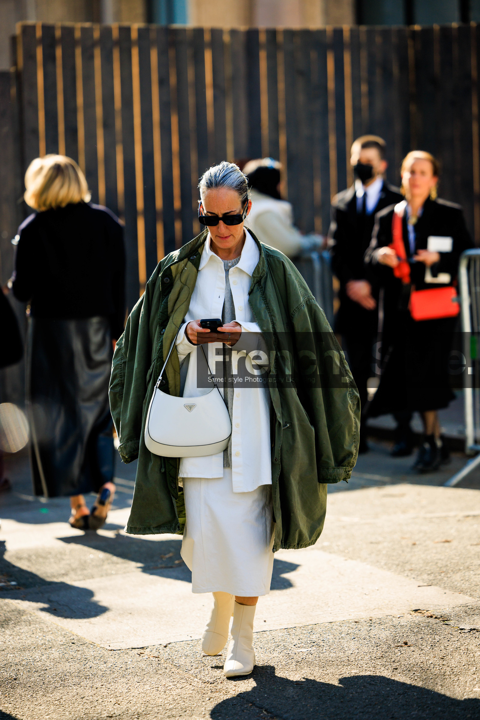 black sunglasses, oversized coat, kaki jacket, prada bag, white handbag, white shirt, white skirt, grey tshirt, white boots, FW 22-23, FALL WINTER 2022_2023, AUTUMN WINTER 2022-2023, fashion week, frenchystyle, FW, jonathan paciullo, street style, PFW, PARIS, full length, vertical