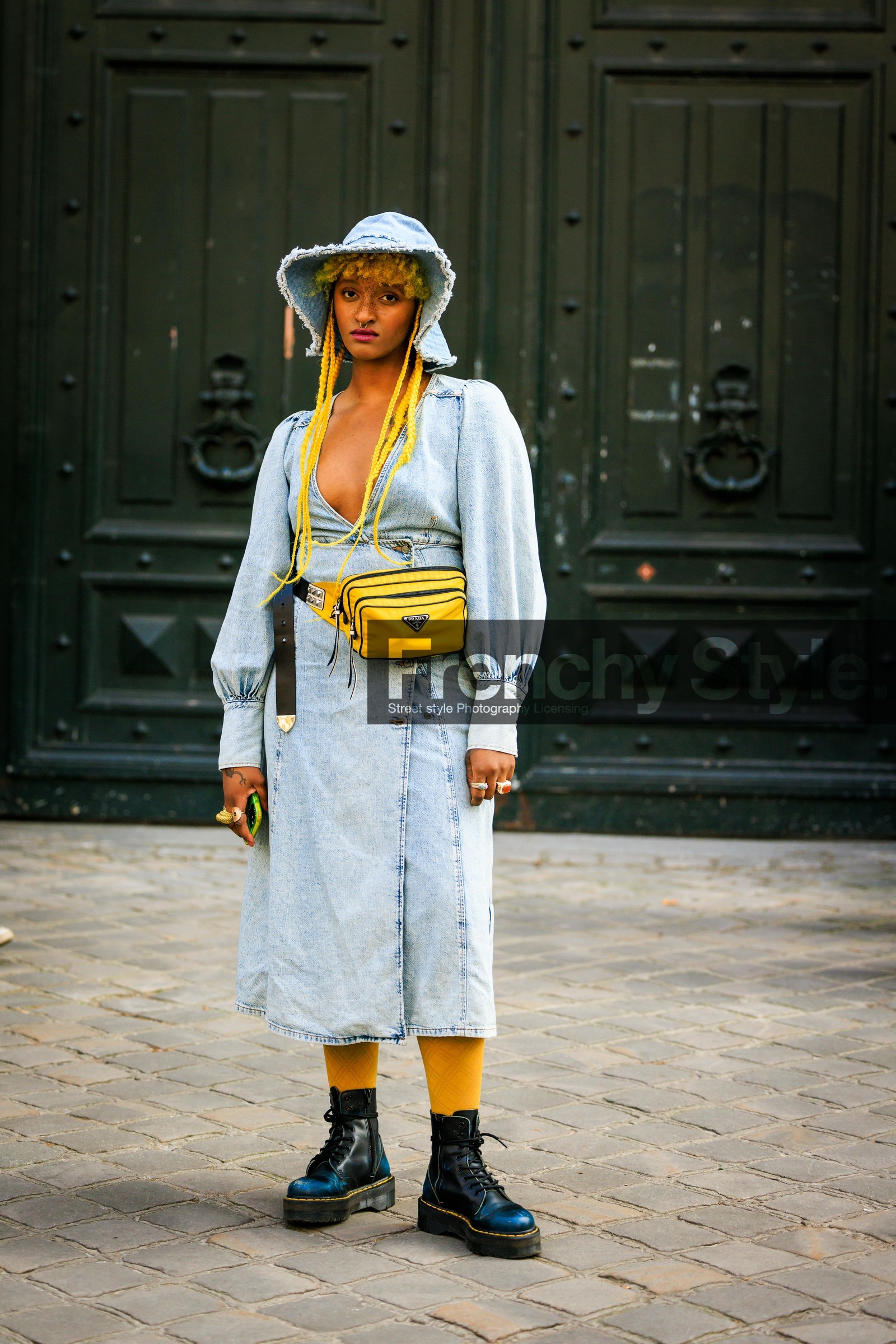 denim look, washed denim dress, bucket hat, denim hat, nylon fanny pack, prada fanny pack, prada bag, yellow hair, braids, afro hair, freckles, dr marten boots, combat boots, black boots, street style, jonathan paciullo, FW, frenchystyle, fashion week, AUTUMN WINTER 2022-2023, FALL WINTER 2022_2023, FW 22-23, PARIS, PFW, full length, vertical