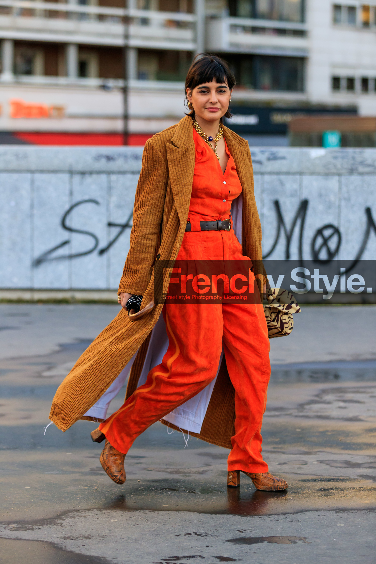 maria bernad, orange jumpsuit, low necked jumpsuit, button jumpsuits, belted jumpsuit, camel coat, velvet coat, corduroy coat, corduroy jacket, camel jacket, velvet jacket, long jacket, golden necklace, big chain necklace, charms necklace, multi necklace, flare jumpsuits, black leather belt, black bag, striped bag, beige bag, zebra bag, hand bag, satin bag, brown bag, knot details bag, round shape bag, golden earrings, hoop earrings, camel leather boots, animal skin boots, high heels boots, fashion week, frenchystyle, FW, jonathan paciullo, street style, PFW, PARIS, AUTUMN WINTER 2020-2021, FALL WINTER 2020-2021, FW 20-21, vertical, full length