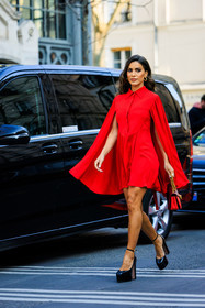 cape dress, red dress, mini dress, flared dress, valentino, golden loops, red handbag, black heels, platform heels, camila coelho, street style, jonathan paciullo, FW, frenchystyle, fashion week, AUTUMN WINTER 2022-2023, FALL WINTER 2022_2023, FW 22-23, PARIS, PFW, full length, vertical