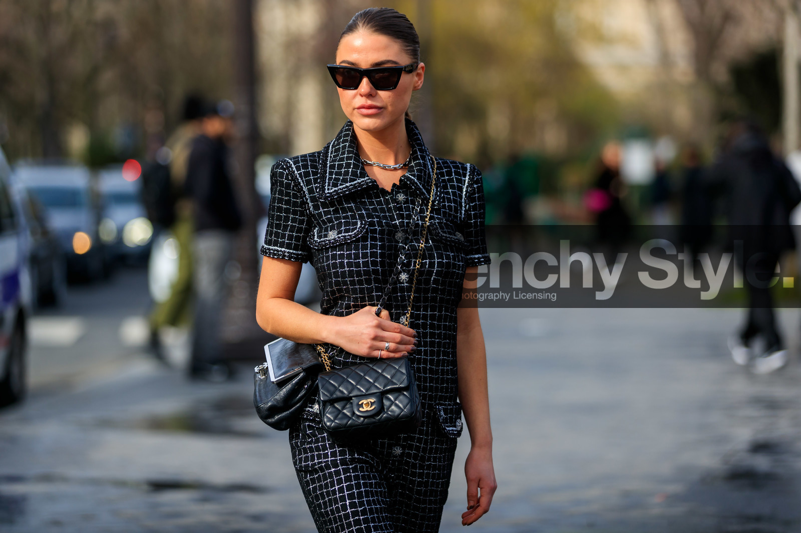 sophia roe, black jumpsuit, checked jumpsuit, short sleeves jumpsuit, multi pocket jumpsuit, silvered jumpsuit, lurex jumpsuit, crossbody bag, black sunglasses, celine sunglasses, butterfly sunglasses, button jumpsuits, black leather bag, quilted bag, silvered chain strap bag, golden chain strap bag, multi bag, chanel bag, chanel jumpsuit, fashion week, frenchystyle, FW, jonathan paciullo, street style, PFW, PARIS, horizontal, atmosphere details, detail