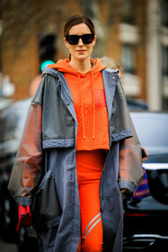orange hoodie, rain coat, grey jacket, loewe coat, black sunglasses, orange leggings, red handbag, loewe handbag, gala gonzalez, street style, jonathan paciullo, FW, frenchystyle, fashion week, AUTUMN WINTER 2022-2023, FALL WINTER 2022_2023, FW 22-23, PFW, PARIS, vertical, detail