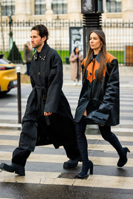 couple matching, black trenchcoat, black trousers, black boots, black leather jacket, dual toned jacker, loop earrings, black handbag, highknee boots, longhair, alice & j.s, alice barbier, JS roques, fashion week, frenchystyle, FW, jonathan paciullo, street style, AUTUMN WINTER 2022-2023, FALL WINTER 2022_2023, FW 22-23, PFW, PARIS, vertical, full length