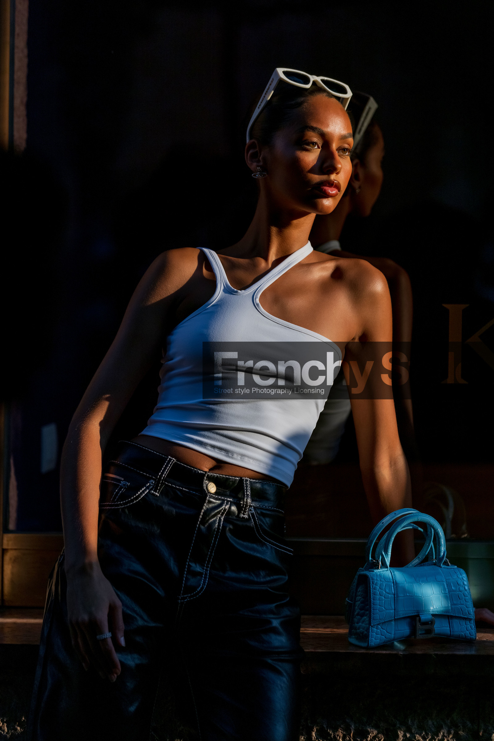 asymetrical top, bag, balenciaga bag, blue bag, bun, croc bag, detail, hourglass bag, Jamilla Stand, leather bag, smartphone, sunglasses, watch, white sunglasses, white top, fashion week, frenchystyle, FW, jonathan paciullo, street style, MFW, MILAN, SPRING SUMMER 2022, SS 22, vertical, atmosphere details