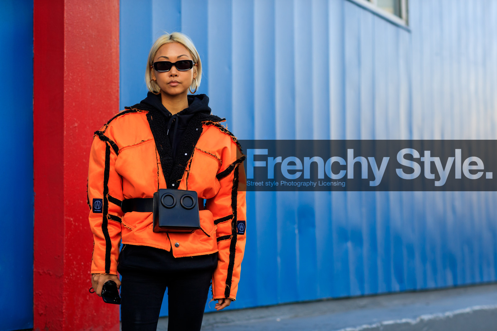 black bag, black belt, black denim, black sweater, denim pants, fanny pack, graphic jacket, hoodie, jeans, leather bag, leather belt, orange jacket, printed jacket, sunglasses, trousers, street style, jonathan paciullo, FW, frenchystyle, fashion week, NYFW, NEW YORK, AUTUMN WINTER 2018-2019, AW 18-19, FALL WINTER 2018-2019, FW 18-19, atmosphere details, horizontal, detail, vanessa hong