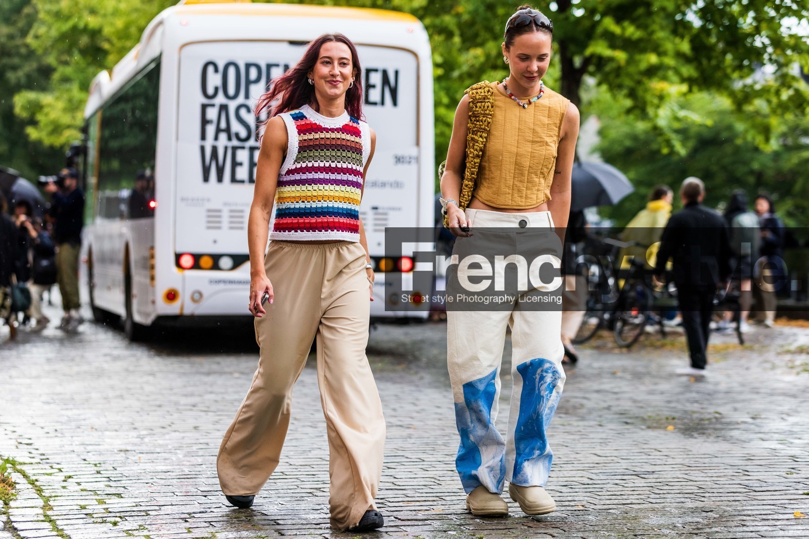 multicolor pullover, striped pullover, rainbow pullover, sleeveless pullover, light beige pants, sleeveless top, quilted top, yellow top, white jeans, loose jeans, loose pants, printed jeans, fashion week, frenchystyle, FW, jonathan paciullo, street style, SPRING SUMMER 2022, SS 22, COPENHAGEN, CPHFW, atmosphere details, horizontal, full length