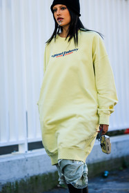 diesel sweatshirt, yellow sweatshirt, black beanie, mouth accesorie, laced dress, silver camera, fashion week, frenchystyle, FW, jonathan paciullo, street style, MFW, MILAN, FALL WINTER 2022_2023, AUTUMN WINTER 2022-2023, FW 22-23, vertical, atmosphere details