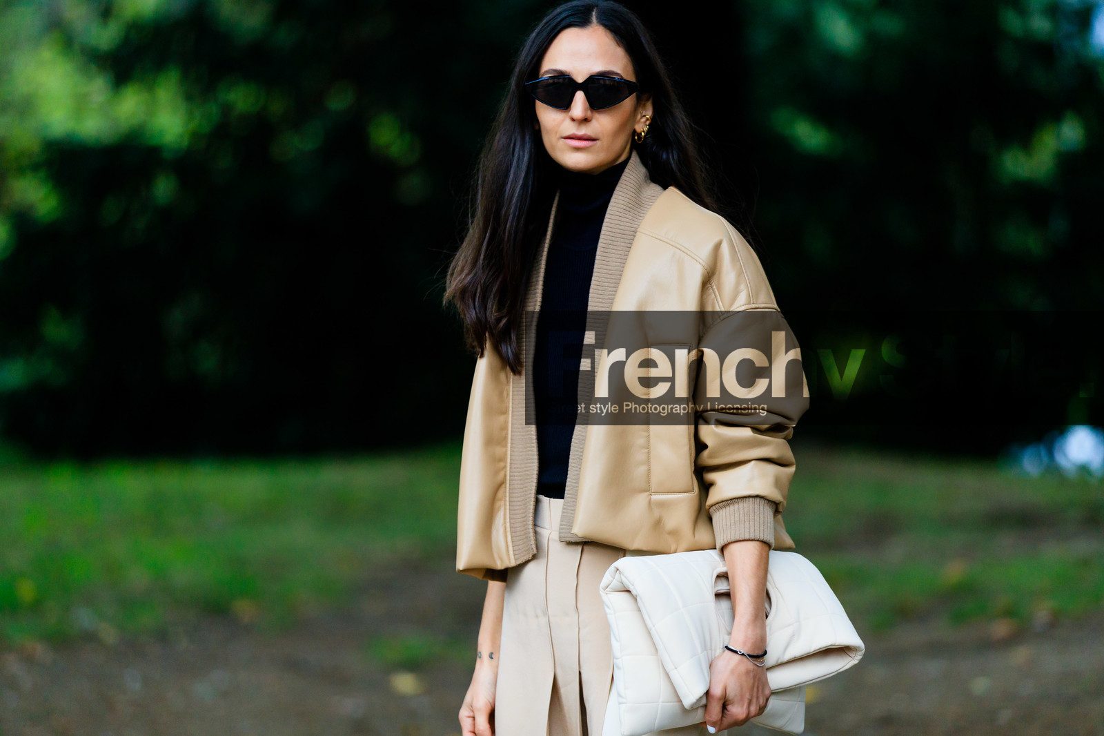 light beige leather jacket, light beige leather bombers, bombers jacket, light beige skirt, white leather clutch, white skirt, black pullover, black sunglasses, futurist shape sunglasses, turtleneck pullover, quilted clutch, ilenia toma, street style, jonathan paciullo, FW, frenchystyle, fashion week, MFW, MILAN, SPRING SUMMER 2021, SS 21, horizontal, atmosphere details, detail