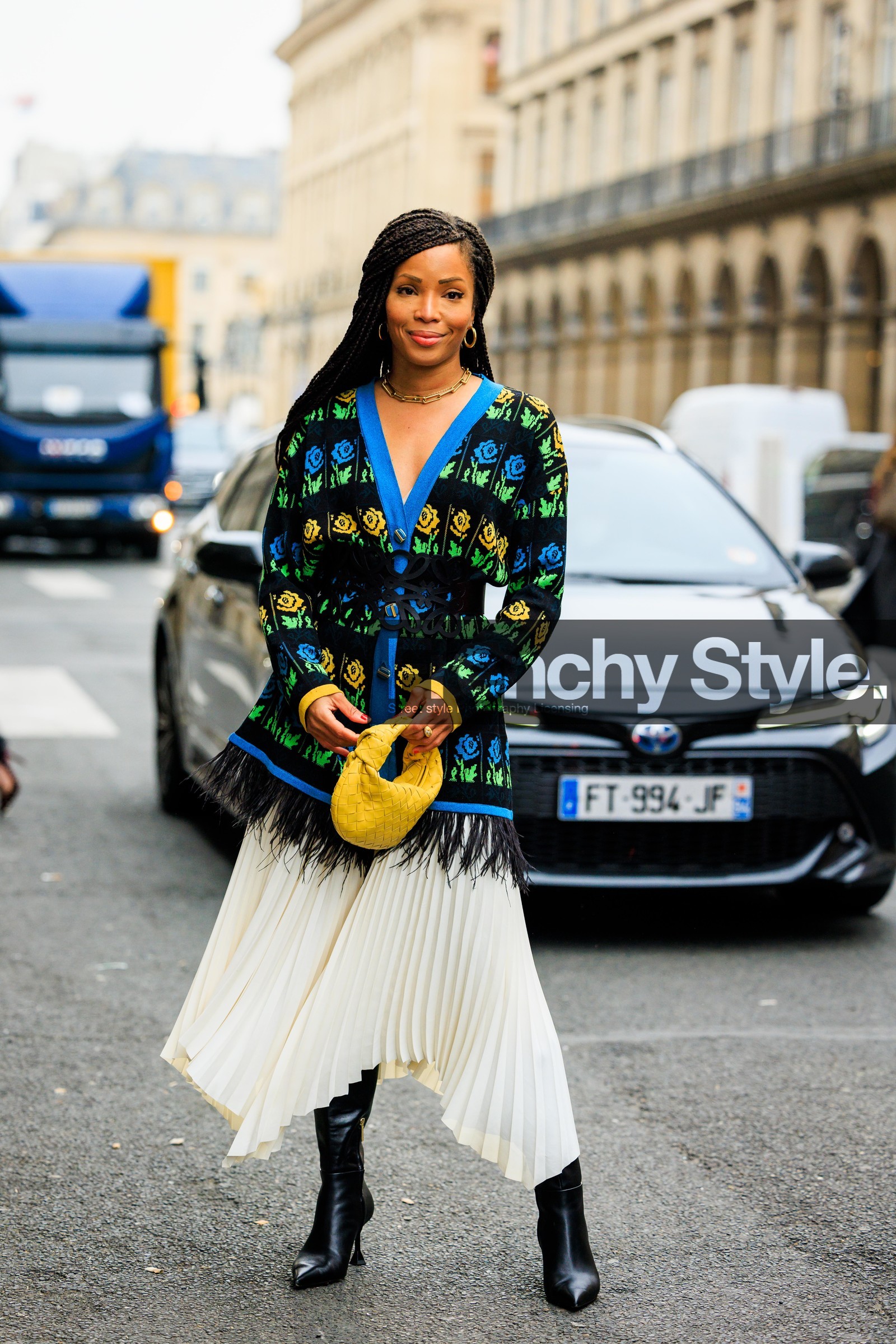 pleated skirt, assymetrical skirt, white skirt, midi skirt, black boots, heeled boots, multicolor cardigan, golden loops, knitted cardigan, knitweat, printe cardigan, ruffle cardigan, yellow bag, bottega veneta pouch, long braids, fashion week, frenchystyle, FW, jonathan paciullo, street style, PARIS, PFW, SPRING SUMMER 2022, SS 22, full length, vertical