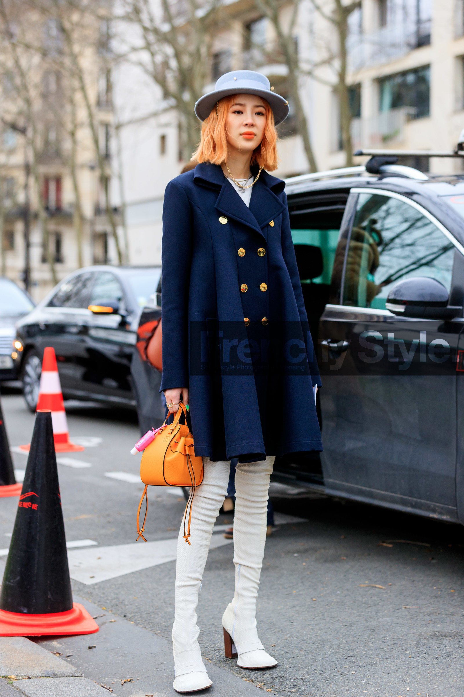 irene kim, orange leather bag, loewe bag, loewe dress, navy blue dress, navy blue coat, jacket dress, light blue hat, pearl detail hat, strassed hat, white leather boots, tight boots, high boots, high heels boots, loewe shoes, loewe look, fashion week, frenchystyle, FW, jonathan paciullo, street style, PFW, PARIS, AUTUMN WINTER 2020-2021, FALL WINTER 2020-2021, FW 20-21, vertical, full length