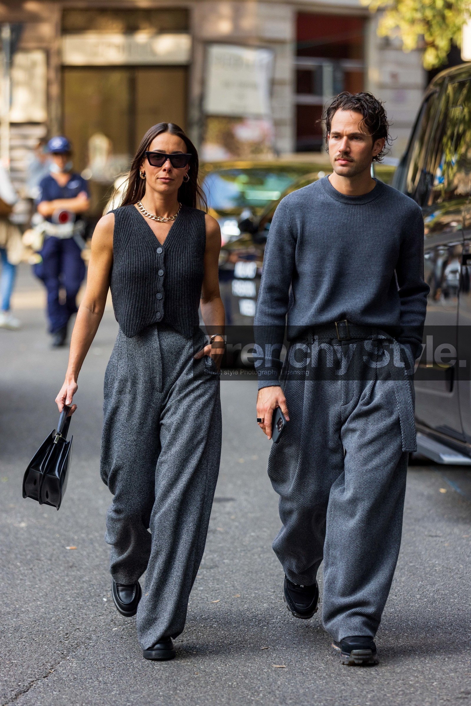 Alice Barbier, belted pants, black bag, black shoes, cardigan, couple, duo, gold chain, grey knit, grey monochrome, Jean-Sebastien Roques, knit, large pant, leather bag, leather shoes, menswear, monochrome, oversize pants, ribbed cardigan, sleveless cardigan, wool pants, sunglasses, black sunglasses, necklace, gold earrings, fashion week, frenchystyle, FW, jonathan paciullo, street style, MFW, MILAN, SPRING SUMMER 2022, SS 22, vertical, full length