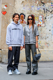 grey leather pants, loose pants, flare pants, black leather boots, big sole boots, laced boots, flat boots, dior bag, dior pants, dior saddle bag, dior total look, dior shirt, prada boots, prada shoes, grey bag, monogrammed bag, logo printed bag, grey shirt, grey hoodie, grey total look, short sleeves shirt, monogrammed shirt, silk shirt, logo printed shirt, eyecat sunglasses, celine sunglasses, black sunglasses, reebok sneakers, margiela shoes, margiela sneakers, blue sneakers, light blue sneakers, light blue leather sneakers, blue leather sneakers, black pants, letter printed hoodie, supreme hoodie, pyjama shirt, fashion week, frenchystyle, FW, jonathan paciullo, street style, PFW, PARIS, SPRING SUMMER 2022, SS 22, vertical, full length