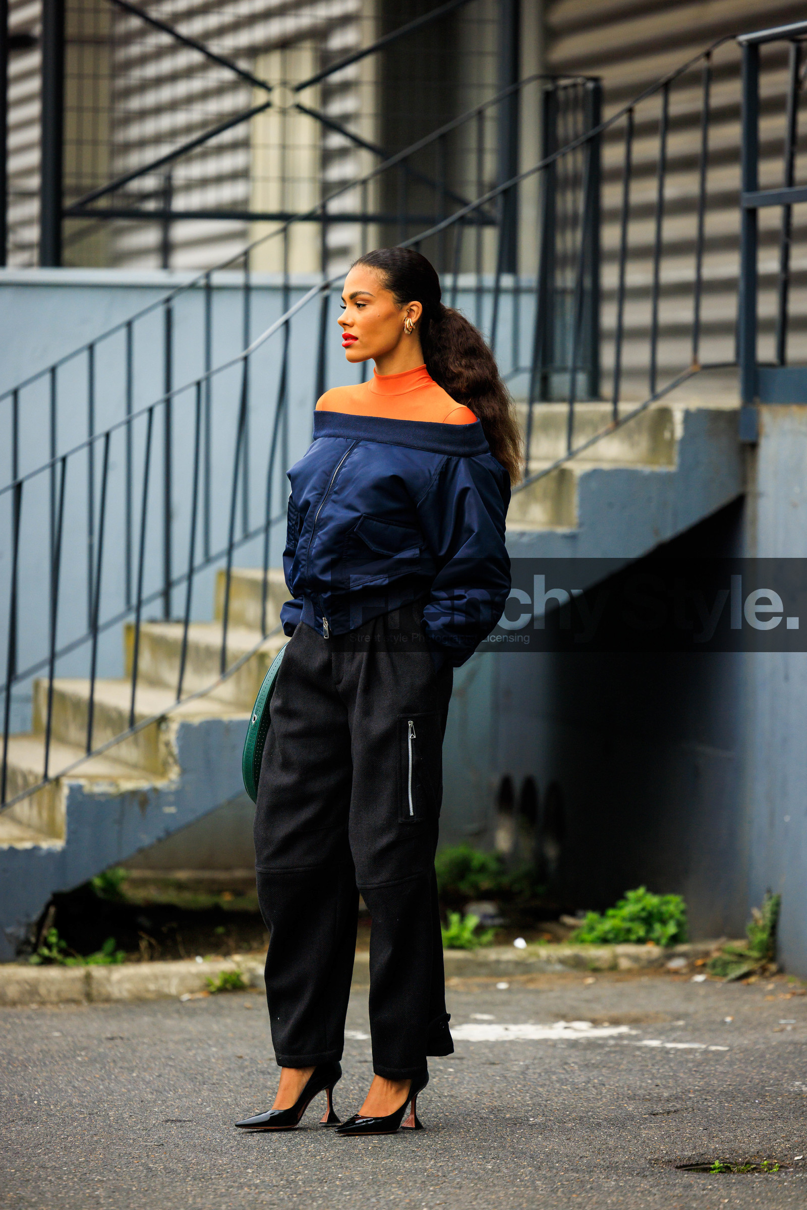 bomber jacket, golden stud earrings, orange turtleneck, black trousers, black stilettos, dark blue jacket, coperni, tina kunakey, street style, jonathan paciullo, FW, frenchystyle, fashion week, AUTUMN WINTER 2022-2023, FALL WINTER 2022_2023, FW 22-23, PFW, PARIS, full length, vertical