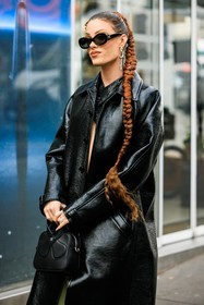 full black look, long braids, orange hair, ginger hair, dyed hair, black sunglasses, big silver earrings, black coat, leather coat, courreges, courreges handbag, black handbag, fashion week, frenchystyle, FW, jonathan paciullo, street style, AUTUMN WINTER 2022-2023, FALL WINTER 2022_2023, FW 22-23, PFW, PARIS, vertical, detail